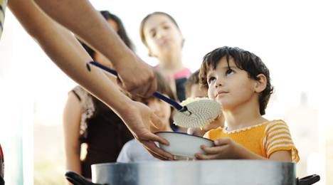 hungry child being fed