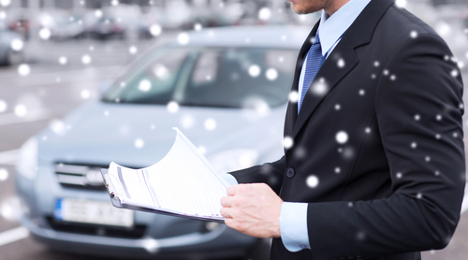 man selling car in snow