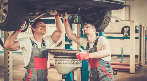 techs changing oil