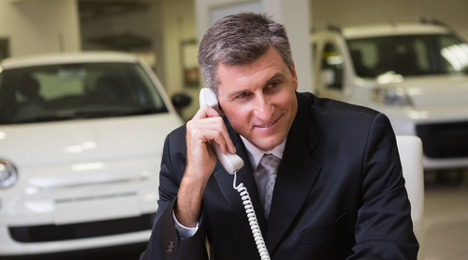 car salesman on phone