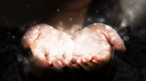 glowing hands of giving
